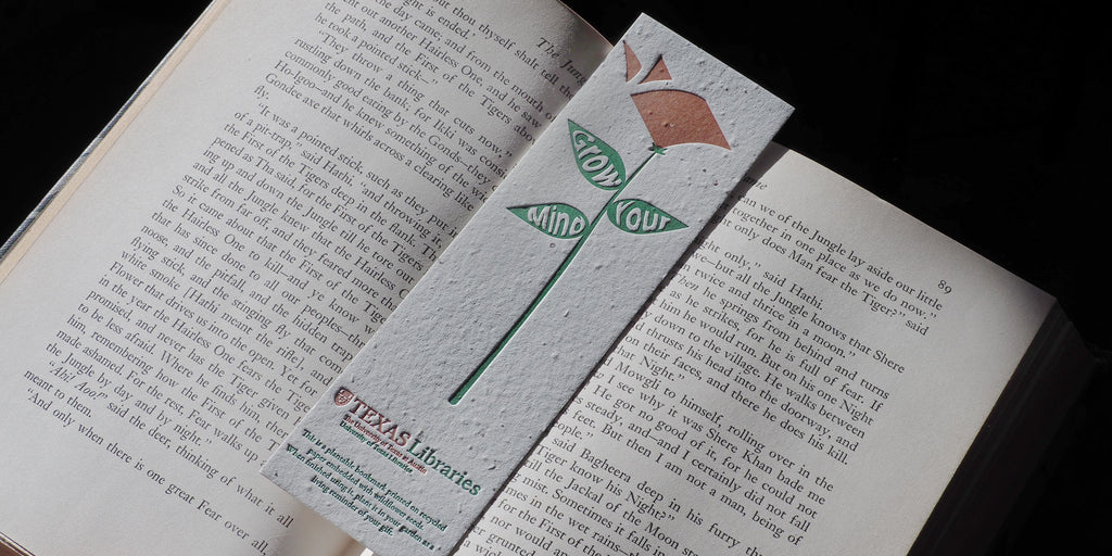 Plantable bookmark in between book pages