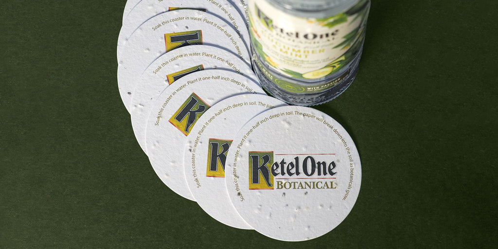 overlapping ketel one coasters around bottle of vodka